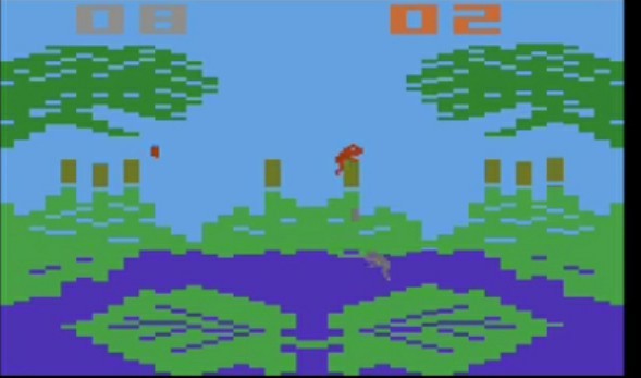 Ekran gry Frogs and Flies na Atari 2600: żaby na liściach lilii nad stawem i lecące muchy